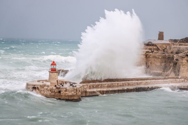Huge wave hitting the breakwater during storm at Fort Ricasoli by Bonavia92